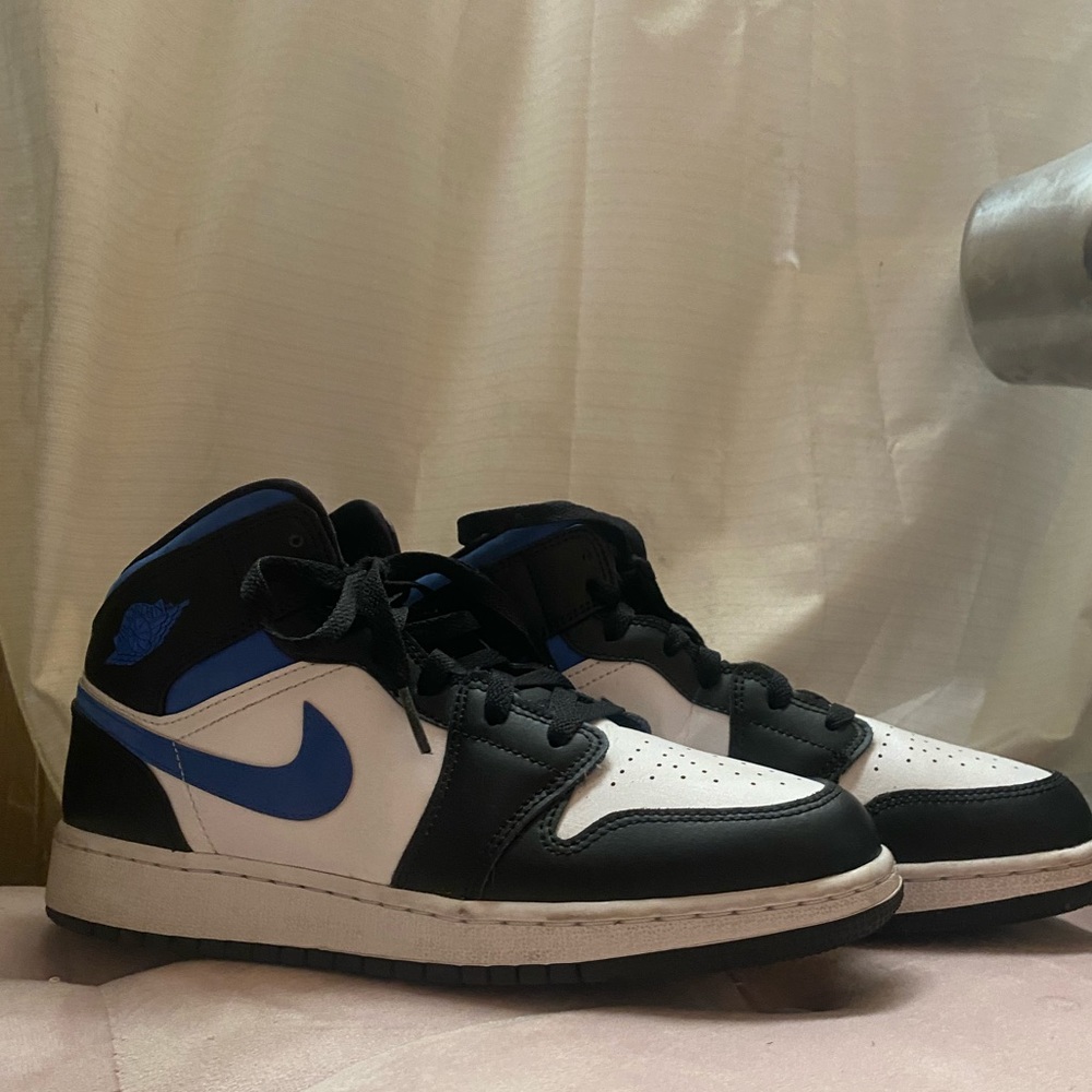 Blue, black, and white air jordan 1's
